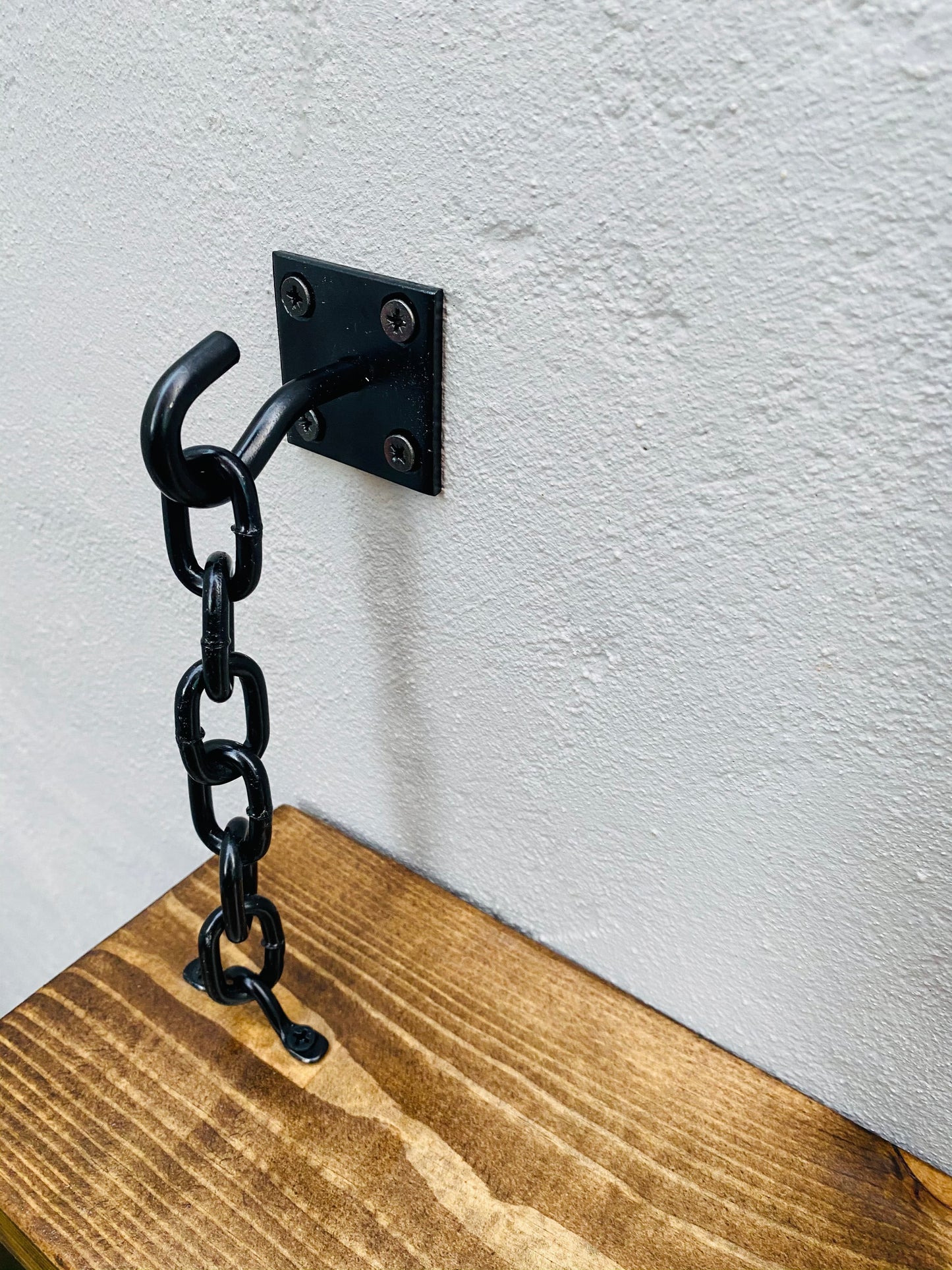 Black hook and chain wall bracket for floating shelf